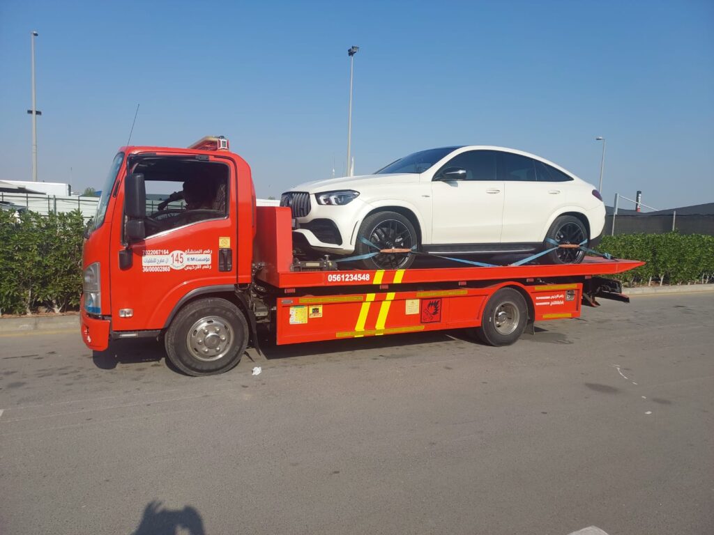 Premium vehicle staged for careful flatbed loading